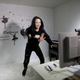 Online hostess Sun Xiaohou gestures to fans as she tries to adjust the web camera before her dance performance broadcast in Beijing